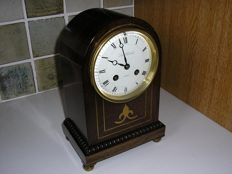 P1080002.JPG - An attractive wooden case Mantle clock retaining a French Movement. Light adjustment plus lubrication.