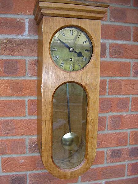 P3130003.JPG - An unusual 'Home Made' Oak cased Wall Clock using a good quality industrial Fusee Drive mechanism.  This clock had dropped from the wall and suffered internal damage plus a split case.  Now repaired, back on the wall and keeping excellent time.